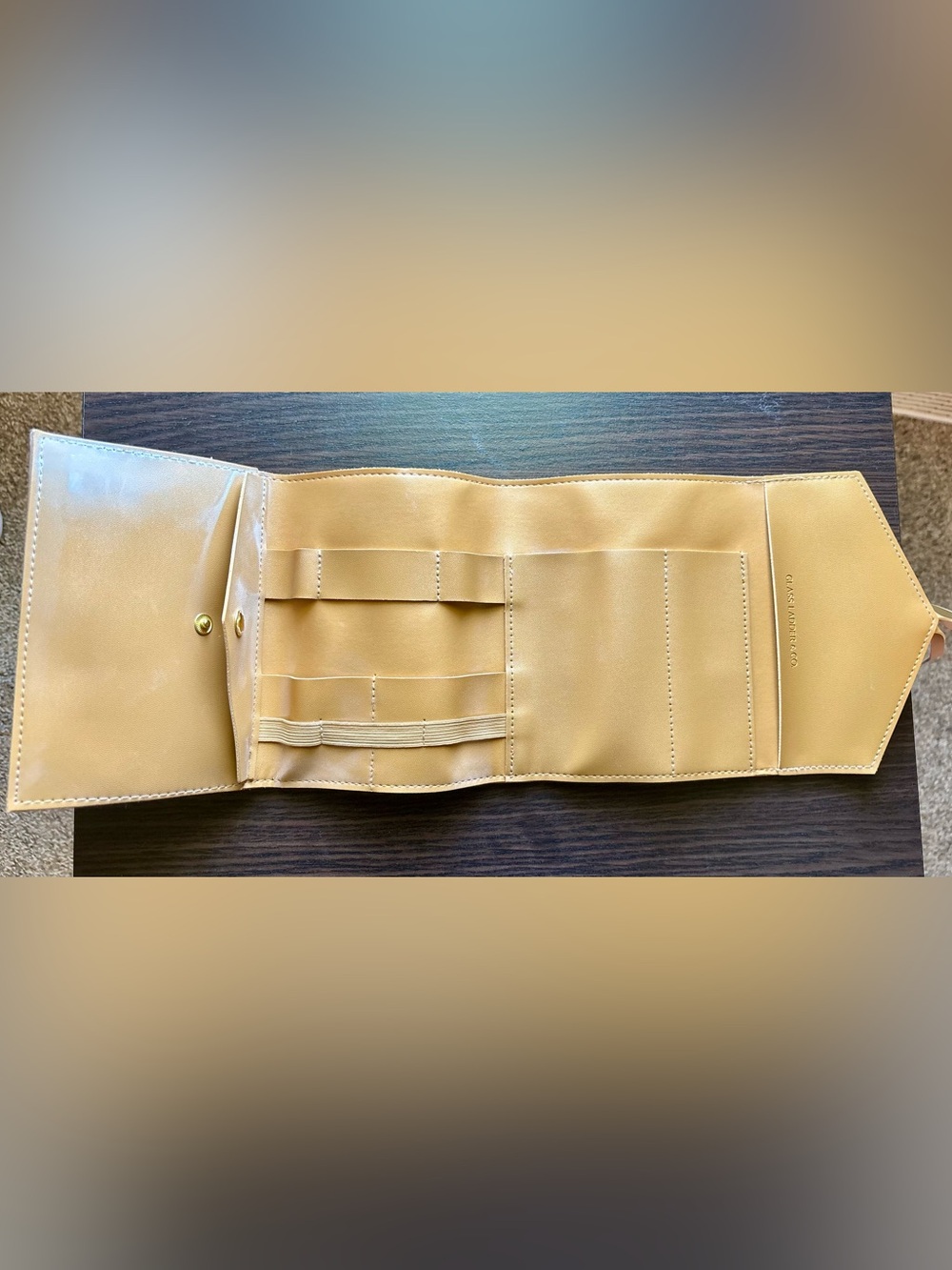 Compact Tan Roll Cosmetic Organizer with Multiple Pockets